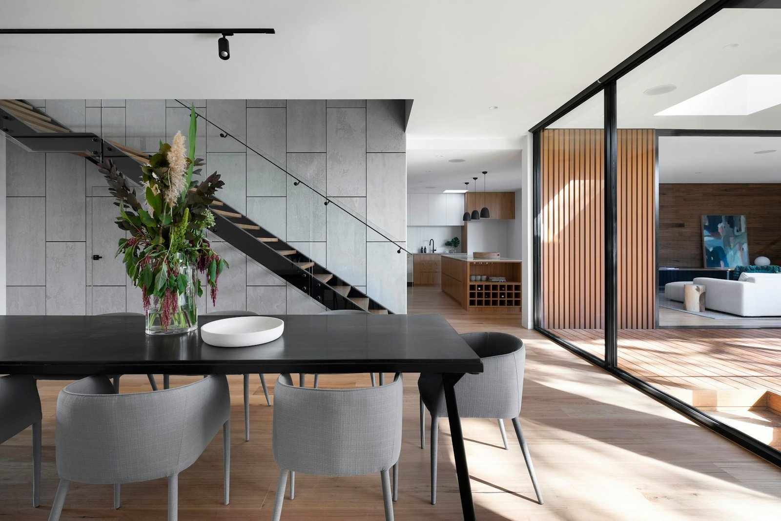 Bright open-plan kitchen with a natural stone island